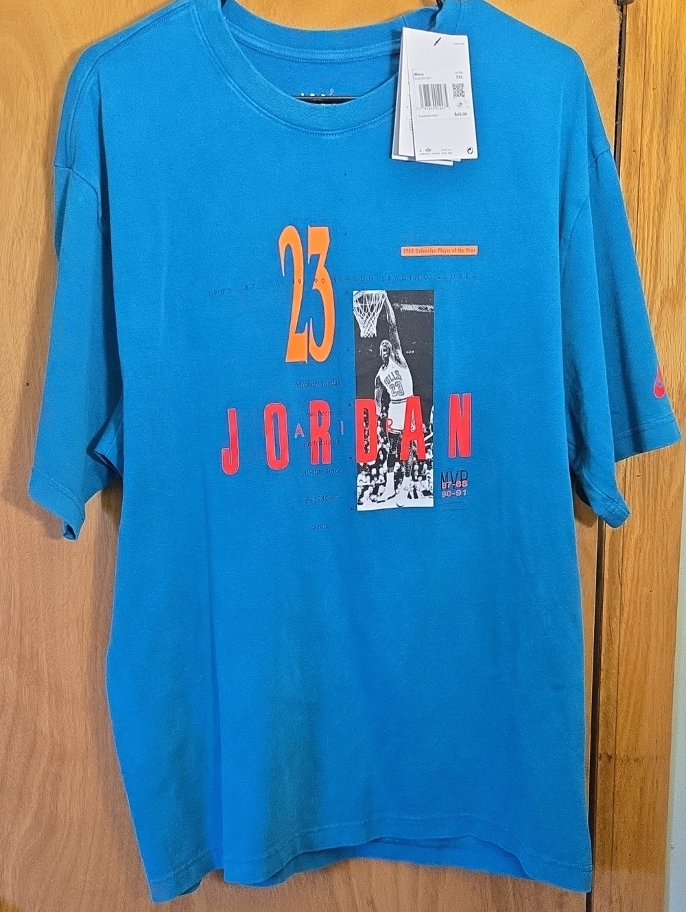 Jordan Teal Short-Sleeve Graphic Tee with Orange and Red Accents